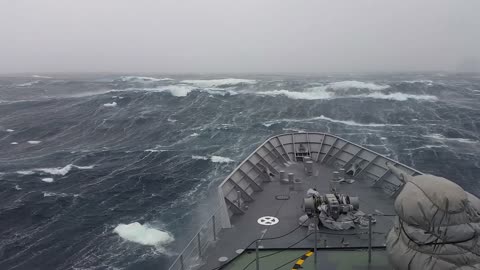 Warship hit by monster waves near