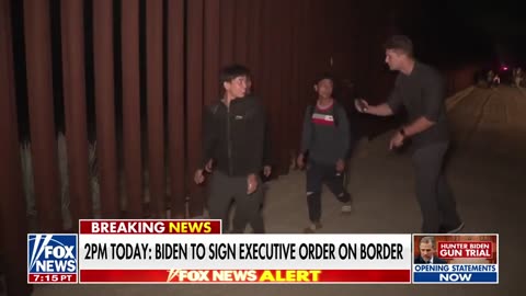 Illegal migrants stop to take selfies while casually crossing the Jacumba California border