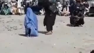 The Taliban whip a woman because she used a mobile phone.