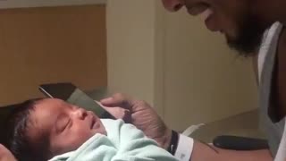 Newborn Baby Smiles When Dad Plays Music On Phone