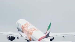 Emirates 777 Orange Expo departing Manchester