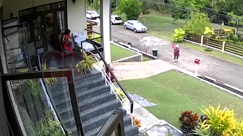 CCTV footage captured bandits attempting to rob a woman as she sat outside her home in Maracas.