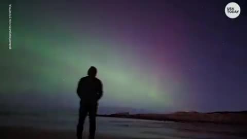 An aurora borealis, like these northern lights, is a natural light display in the Earth's sky...