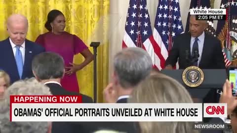 Barack Obama gives a speech after the unveiling of his White House portrait