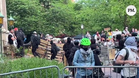 The current scene at @UW Gaza camp as Antifa holds posture to defend the camp.