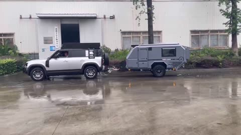 Under the heavy rain customer pick up his brand new njstar rv off road travel trailer