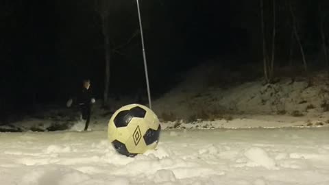 Playing football in the snow