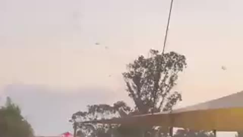 Hamas paragliding into Israel during a festival.