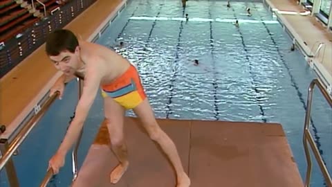 Comic Mr Bean goes swimming and tries to attempt the diving board!