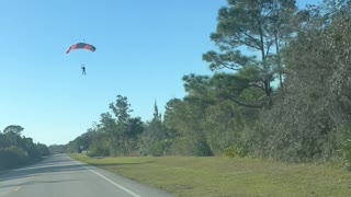 Skydiver Lands on Road