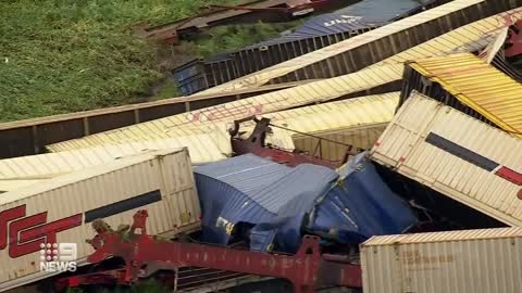 Freight train derails, causes tens of carriages piled up on tracks _ 9 News Australia