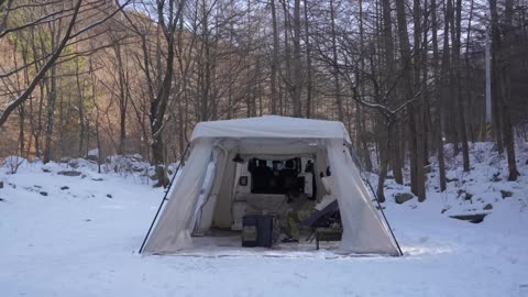 Snowy Frozen wild forest floor alone Camping / Hot Tent in the cold