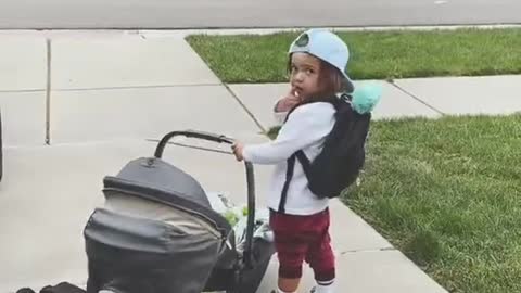 Two Year Old Rocks Baby Sister in Car Seat