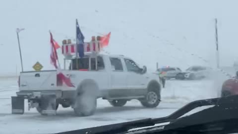 Farmers and protestors pushing past police barricade in Coutts, Alberta border