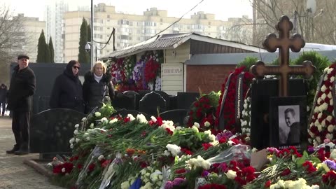 Navalny's mother visits his grave in Moscow