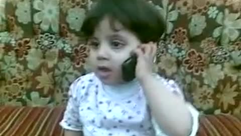 Cuteness on mobile phone, a little baby talking with man with full anger & try to explain