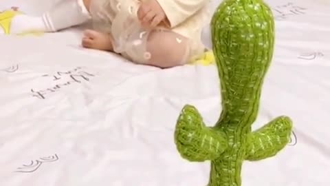 Cute baby scares with cactus toy