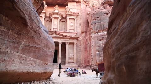 People, horses and camel near Al Khazneh or Treasury at Petra