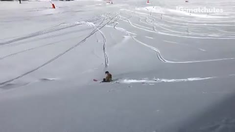 Skier tries to 360 spin off ledge and falls, friend laughs at him