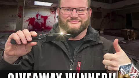 He's got a knife! Because he won it from our Freedom Network Giveaway!