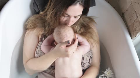 A Mom and Baby Photoshoot while Inside the Bath Tub
