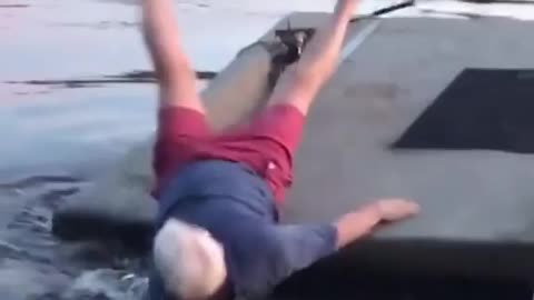 Funny grandpa playing golf in the river