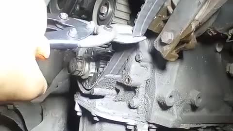 The mechanic cut off the belt.