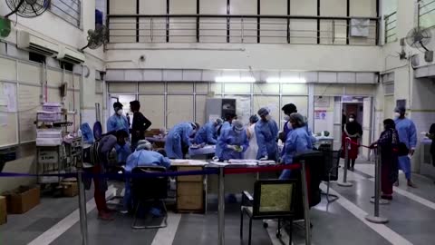 Two to a bed: COVID overwhelms India hospitals