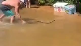 Friends on a Lake Visited by Large Water Snake