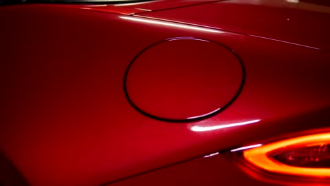 Close up of red sports car Macro close up of a red sports car from taillights to front door.