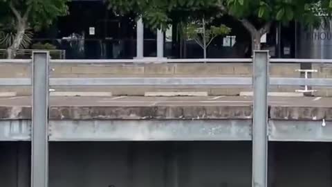 Guy climbing and jumping on house building, cool