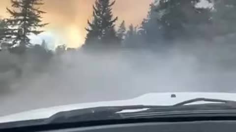 Driver surrounded by Flames and Smokes as Wildfire rages in CANADA