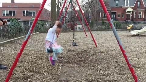 Awesome dad perfects swing stunt at the pAwesome dad perfects swing stunt at the parkark