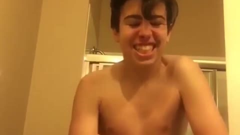 Shirtless kid super saiyan screaming bathroom