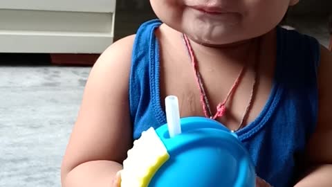 Cute baby drinking water and making faces,doing burrr