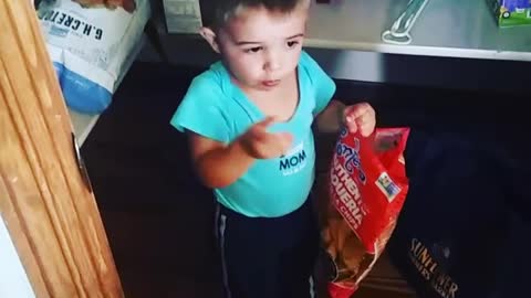 Sneaky Little Boy Eats Chips In The Pantry