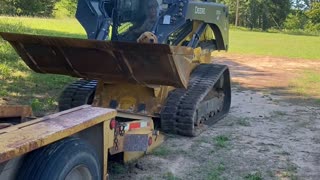 Golden Retriever Gets a Ride in a Skid Steer