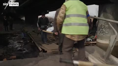 Ukraine War- Dead bodies stretchered out of Irpin