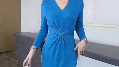 Wearing a blue dress, very elegant