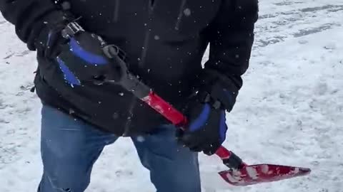 Premier Doug Ford helps dig out a motorist stranded by the snowstorm