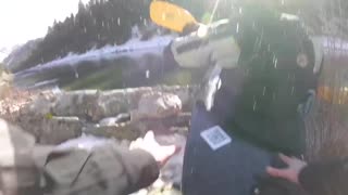 Man in yellow kayak falls into icy snow water