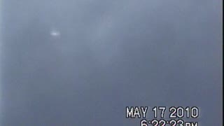 UFO moving into clouds