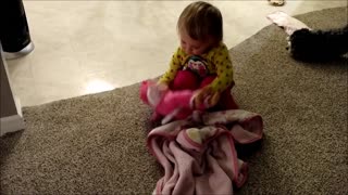 Toddler Cares for Baby Doll