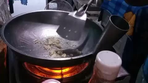 Wife cooking eggplant adobo