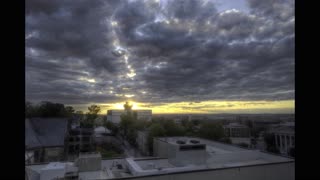 RAW version of HDR Time-lapse video of sunset over cityscape