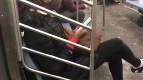 Girl argues on the phone with her boyfriend on subway train, everyone can hear