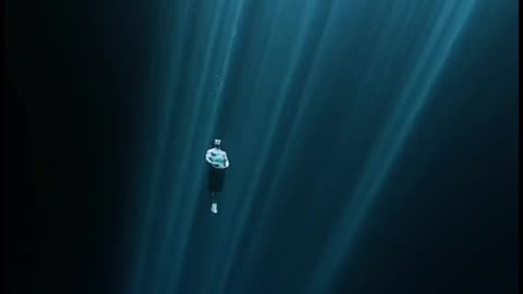 Diving through the darkness of the depths of the Ocean