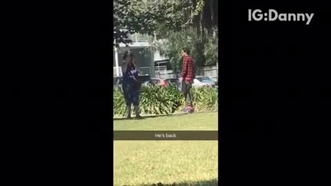 Guy in red plaid flannel rollerskating around with boombox