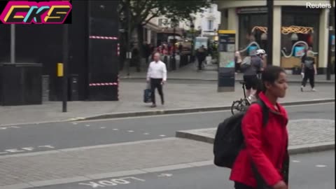 Moment female rioter falls flat on her face pushing bin into police