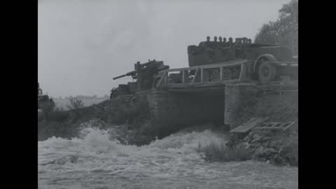 88mm_flak_guns_towed_across_a_bridge